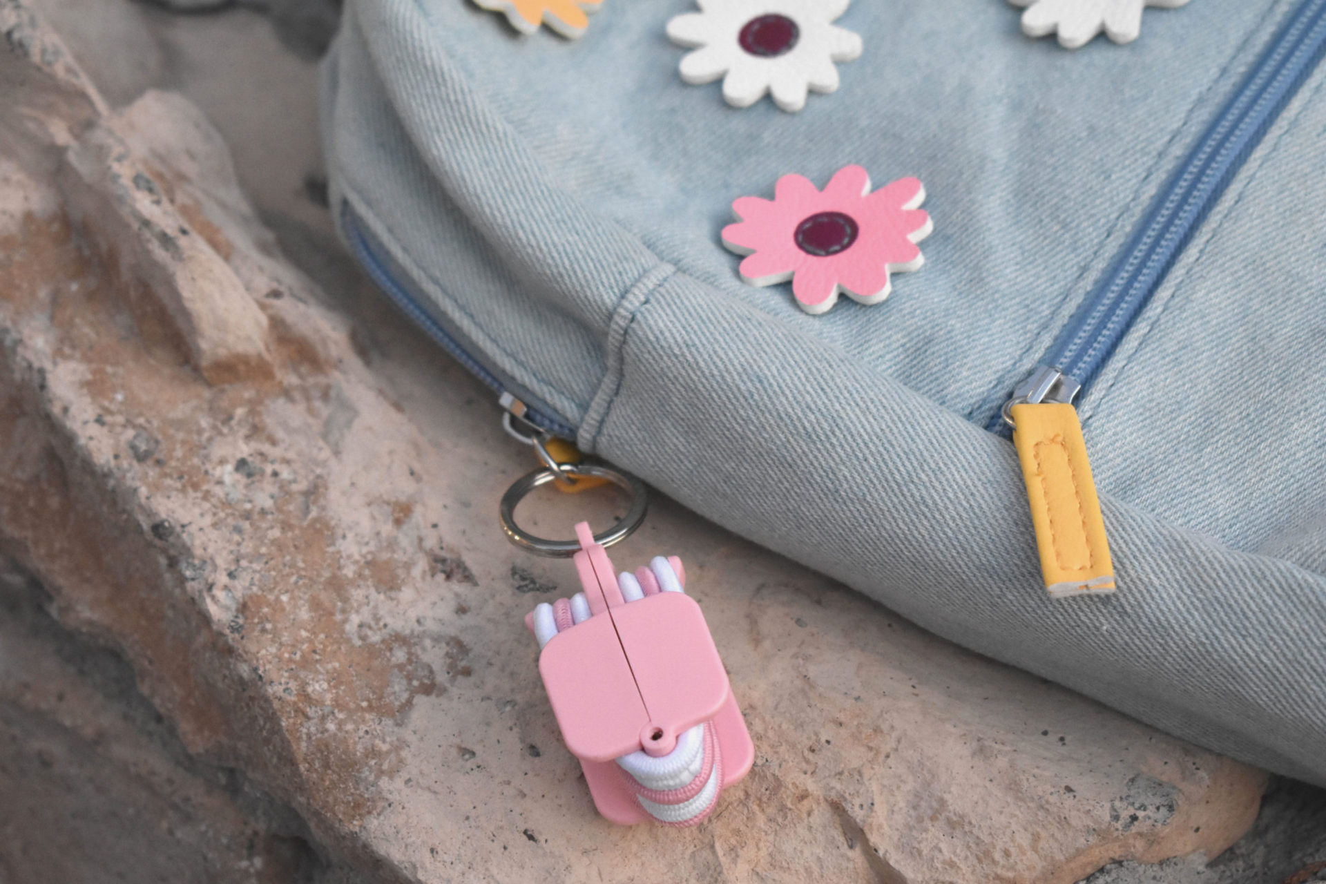 Pink Portable Hair Tie Holder on Backpack